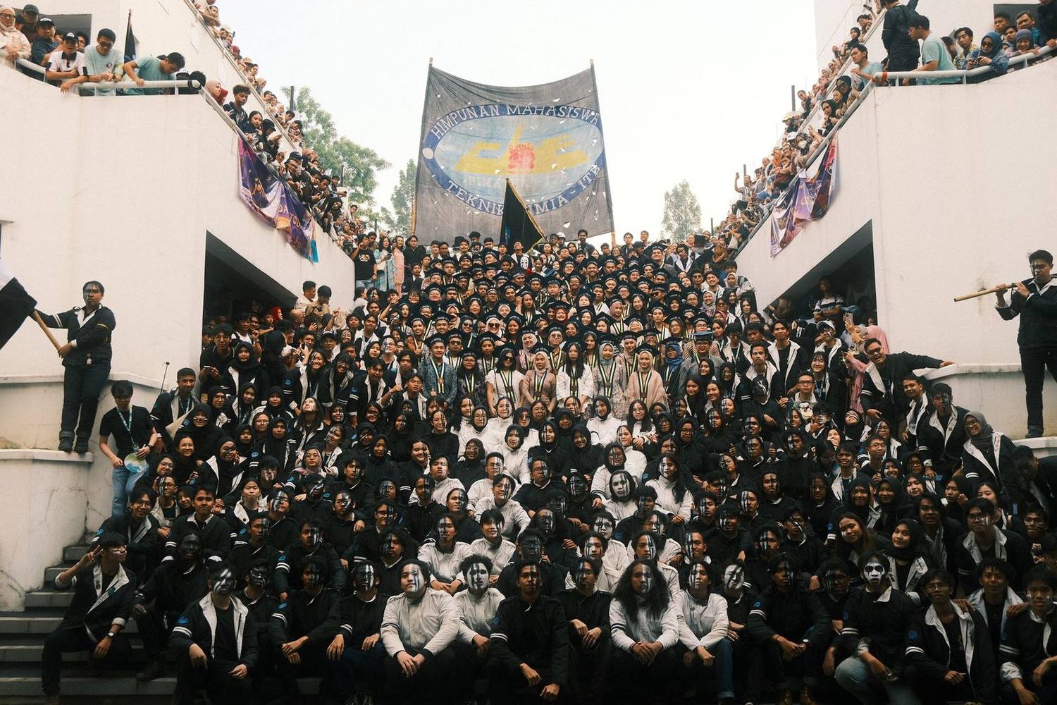 Group photo of all HIMATEK-ITB members on the campus steps