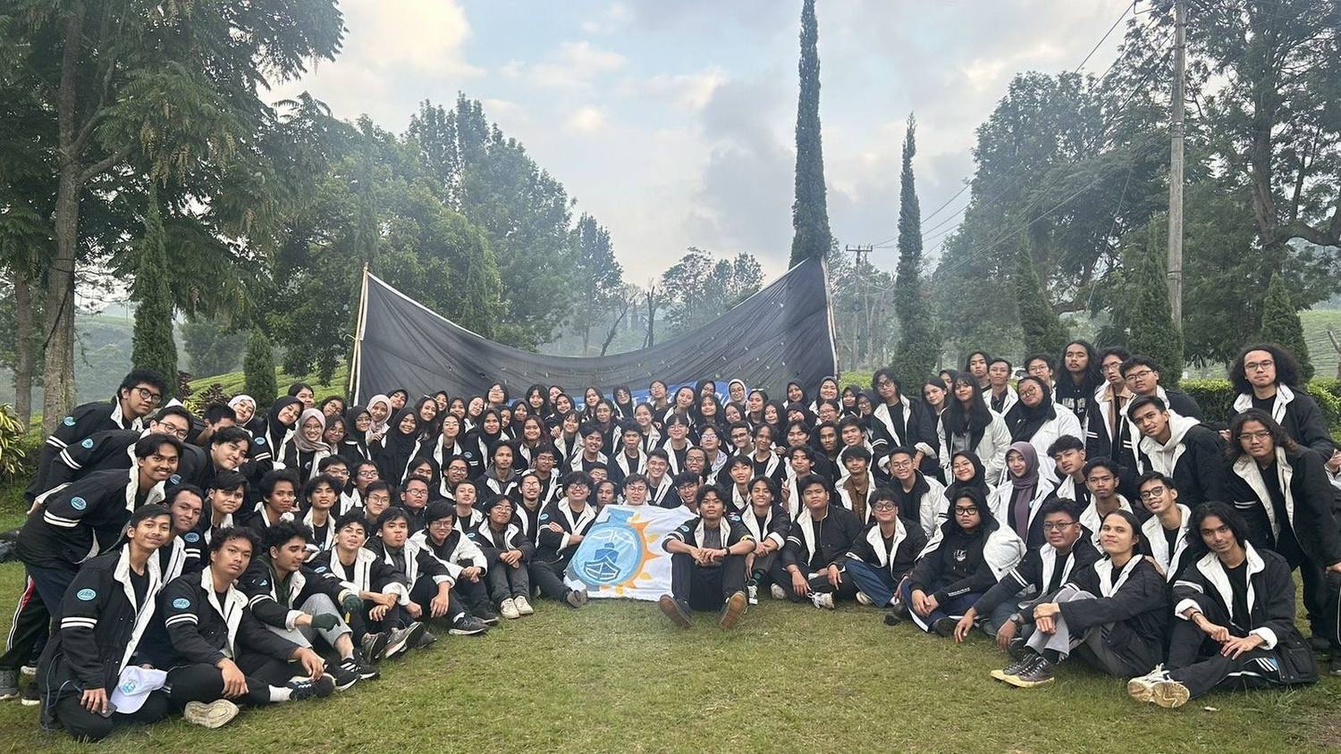 Group photo with a mountain backdrop