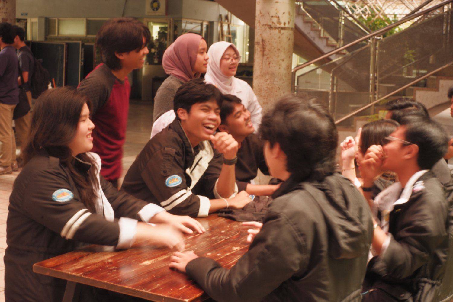 Members laughing together around a table